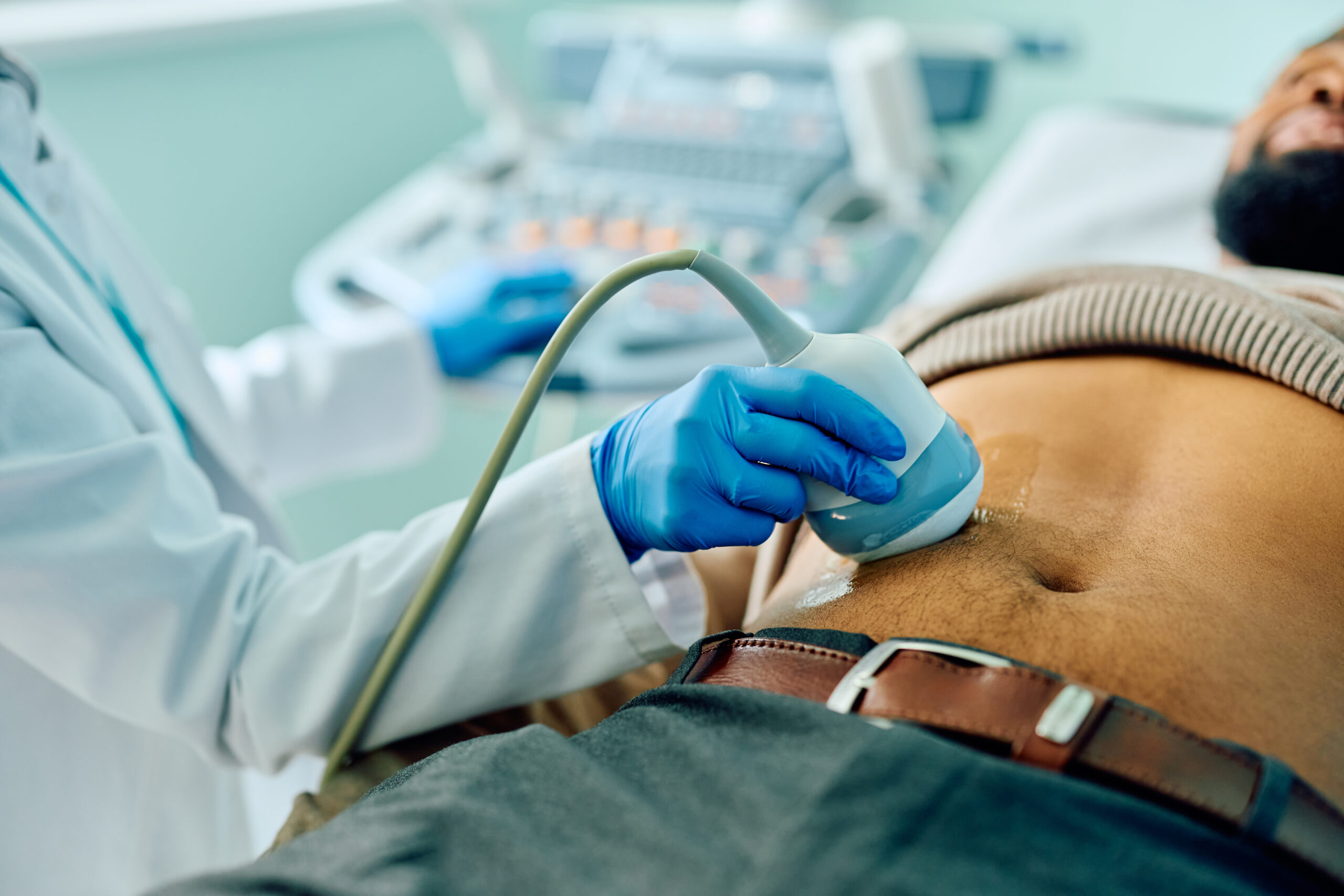 Man receiving kidney ultrasound in doctor's office